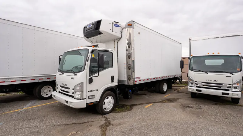 Refrigerated box trucks in the yard