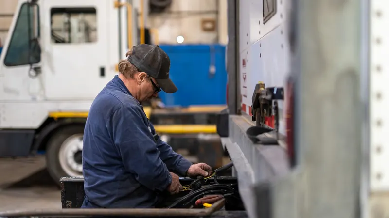 Technician working on a truck body