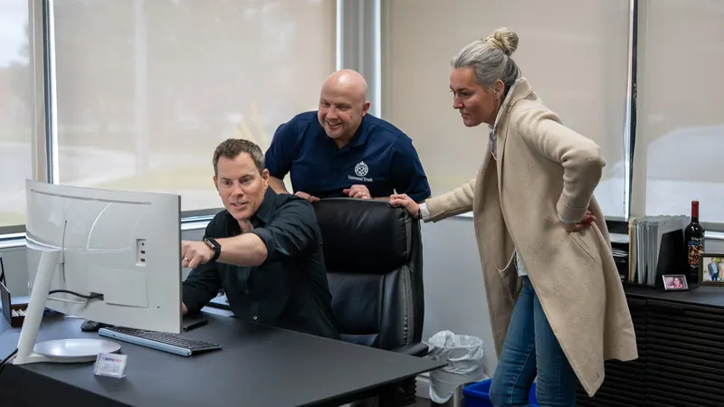 Team reviewing a job on screen