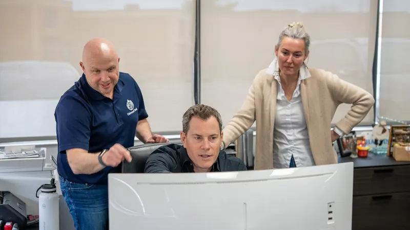 The Universal Truck Bodies team reviewing a job